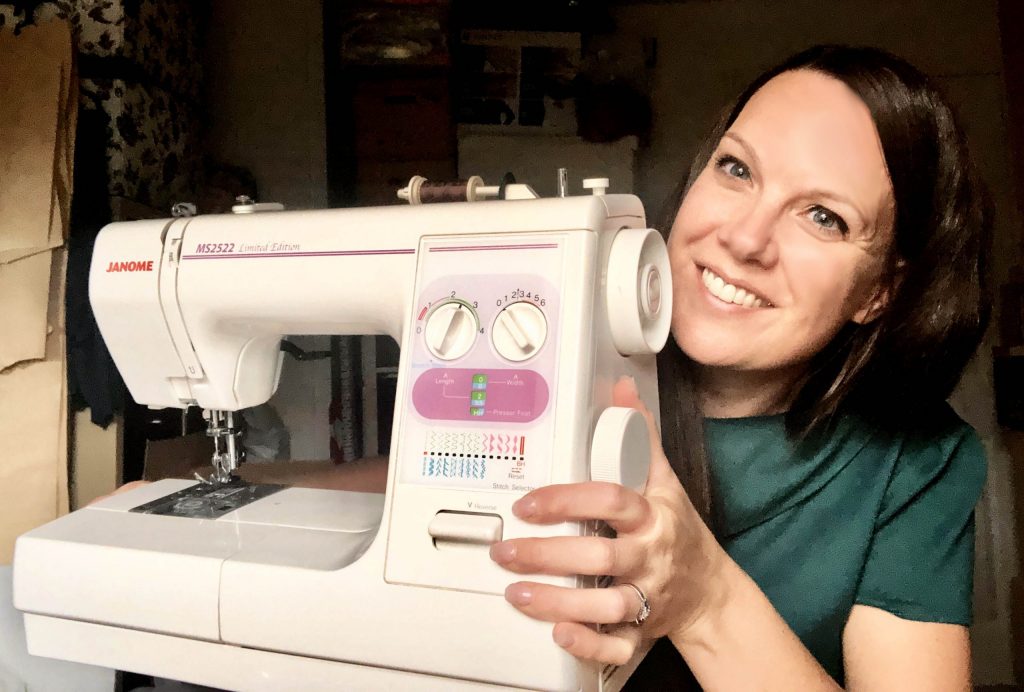 Julia holding up her Janome MS2522 sewing machine