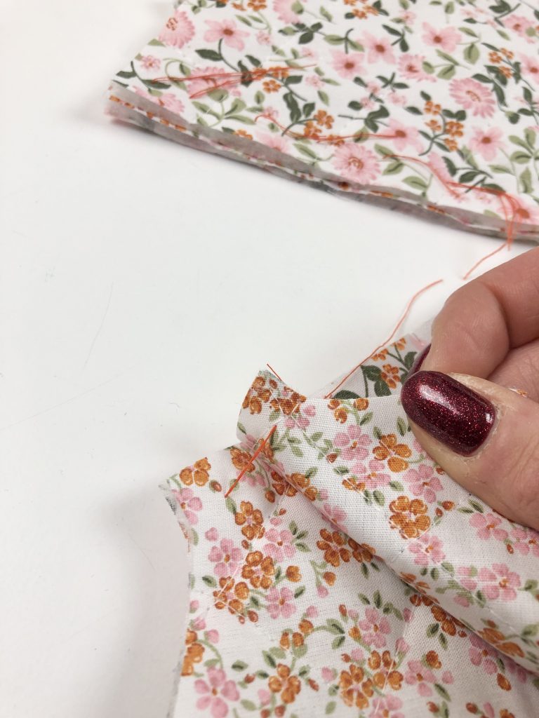 separating the fabric layers and cutting tailor's tacks