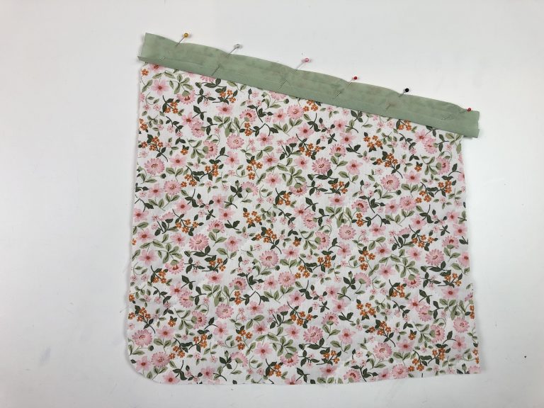 bias binding pinned to the top of a floral pocket