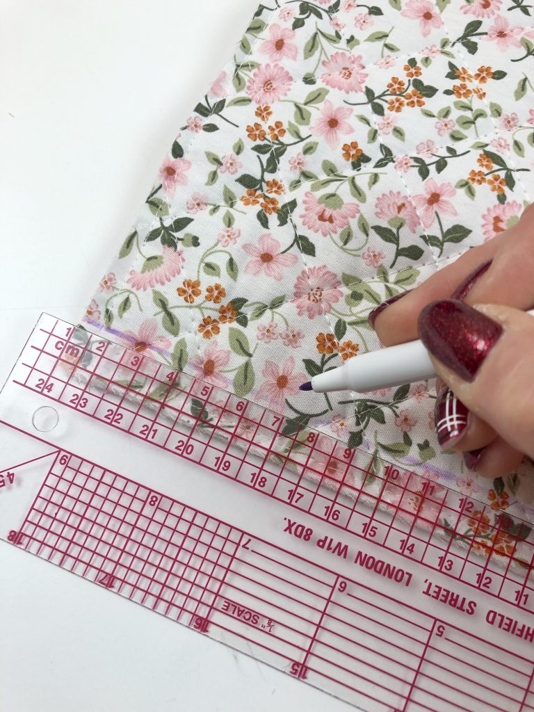 Marking lines onto fabric using a rules and fabric pen