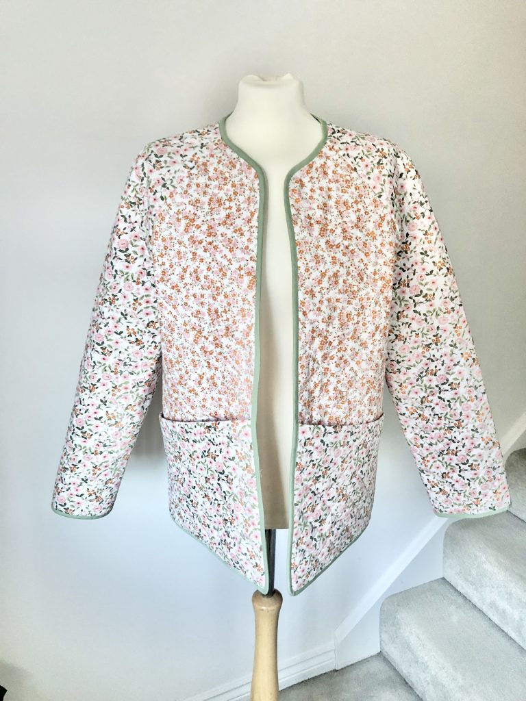 Floral Quilted jacket on a dress form
