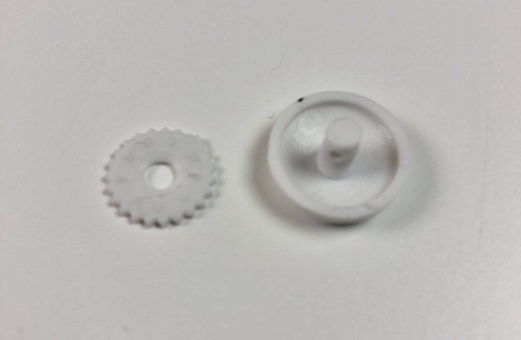 plastic covered button with a flat bottom