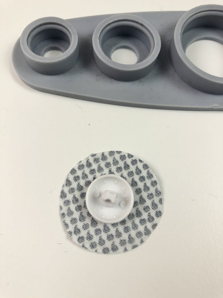 circle of fabric with button on top