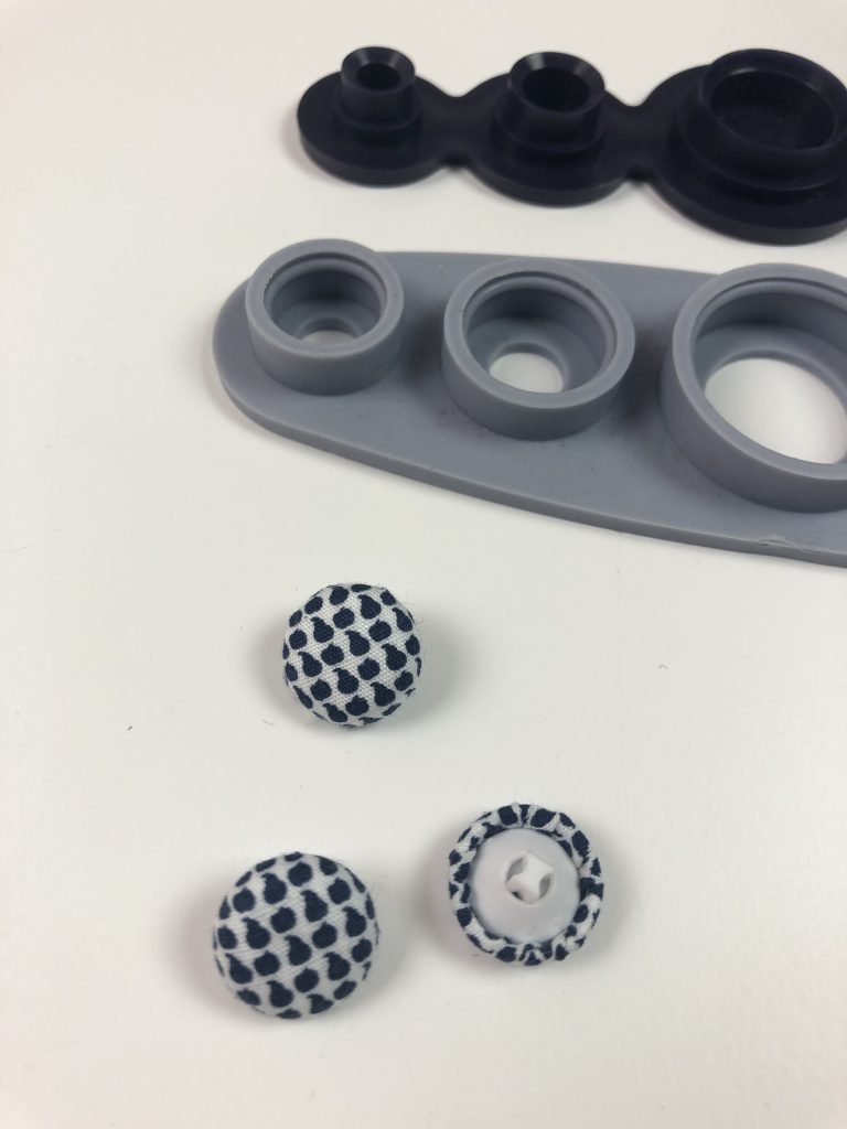 buttons formed using self cover button tool
