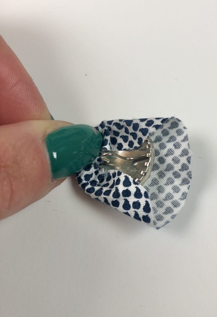 wrapping the fabric around a metal self cover button
