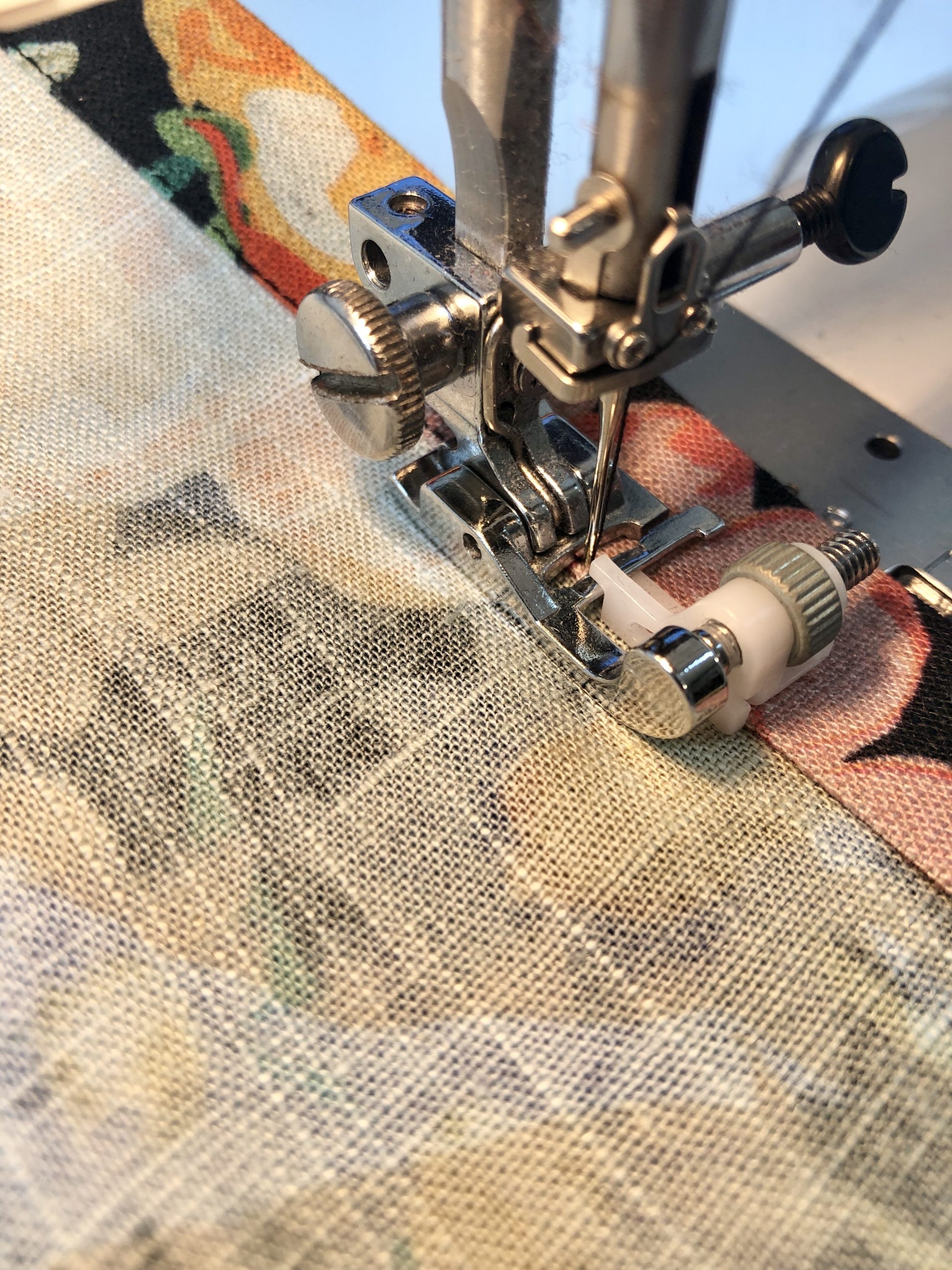 Using a blind hemming foot to keep stitching straight