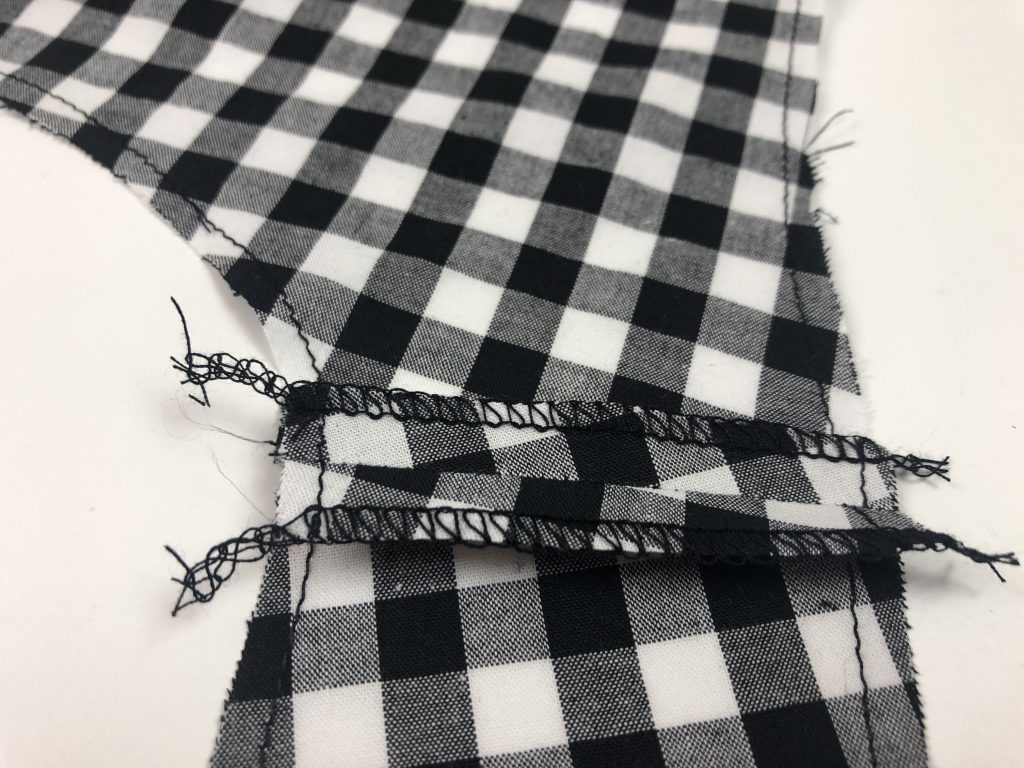 black gingham fabric with overlocked seams pressed open