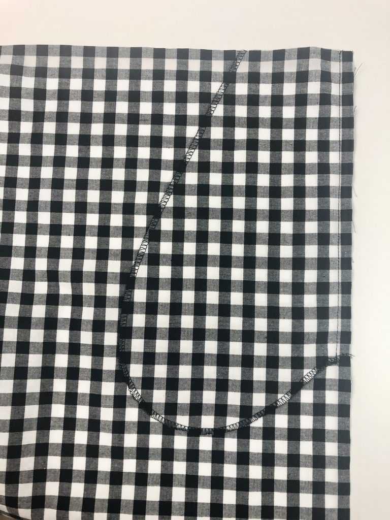 pocket attached to black gingham fabric