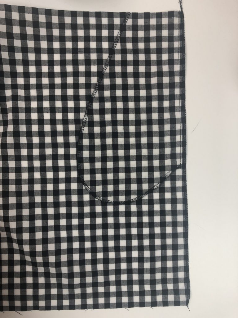 black gingham fabric with a pocket