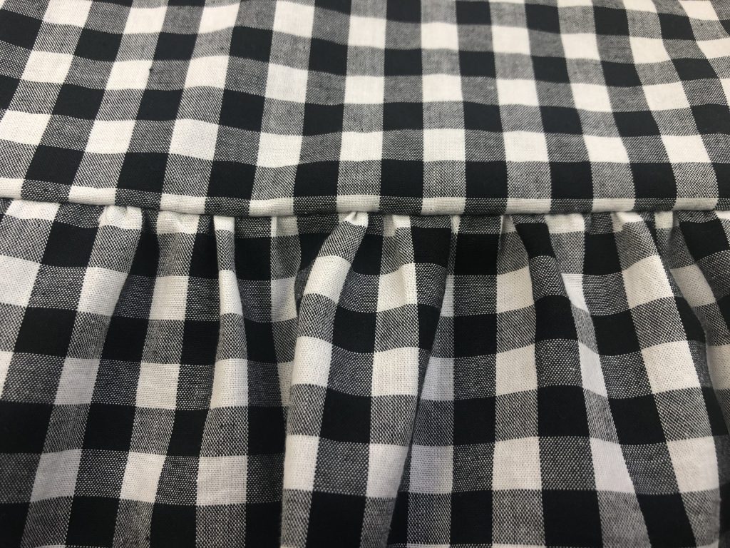 black gingham fabric with gathering