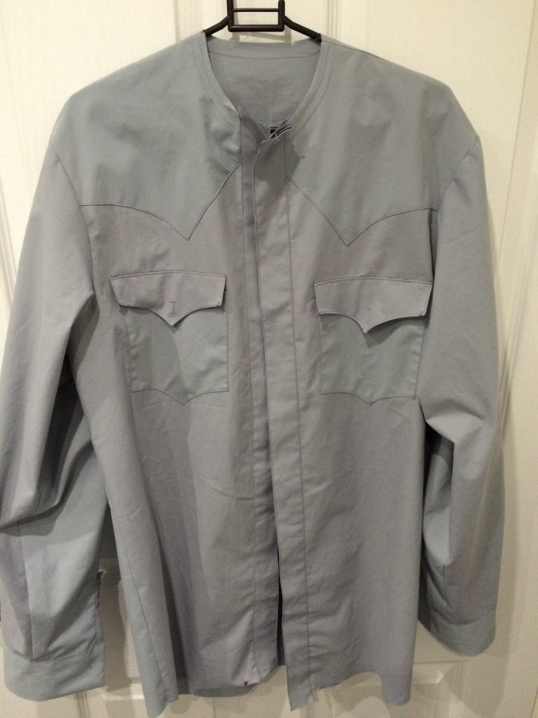 finished shirt made from a light grey bed sheet