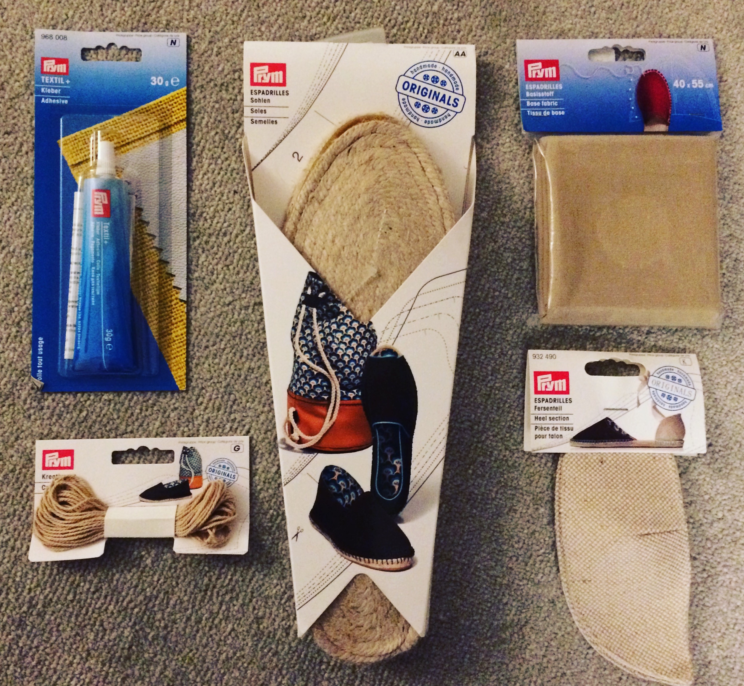 Image of fabric glue, espadrille soles, base cloth, heel sections and beige yarn for sewing together