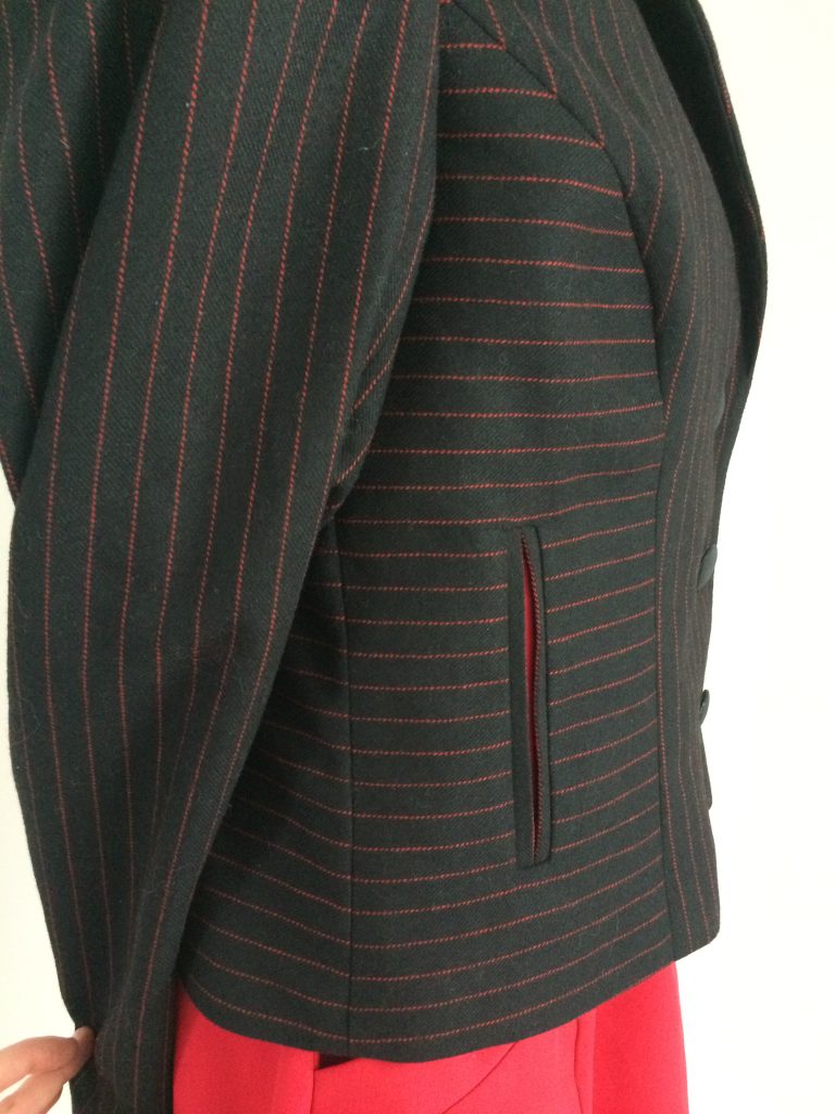 side view of black and red pinstripe jacket