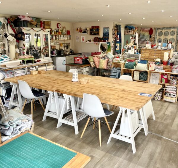 large wooden tables and chairs in the studio at Made and Making in Hassocks