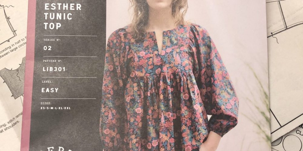 Image of pattern envelope for Esther Tunic showing young woman wearing floral top